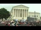 Abortion rights supporters march by the US Supreme Court in Washington DC