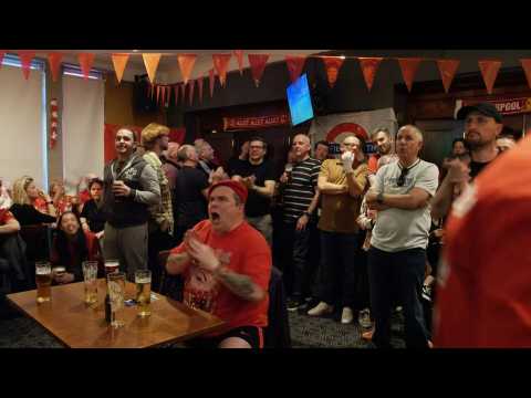 Champions League: Liverpool fans watch the match in a pub