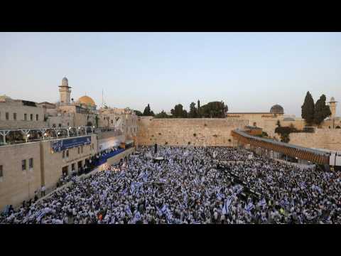 Israelis gather to wave flags at the Western Wall