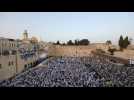 Israelis gather to wave flags at the Western Wall