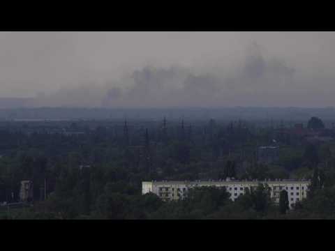 Smoke rises over the front line in Donbass region