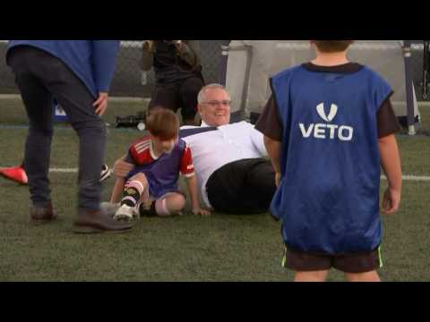 Australian Prime Minister crashes into child during football match on campaign trail