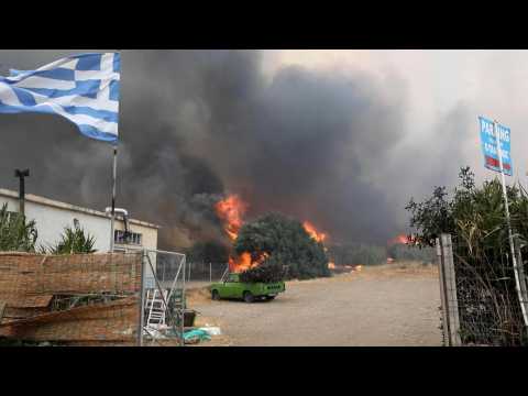 Lesbos wildfire destroys homes and forces evacuations from tourist resorts