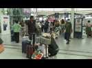 Travellers in Paris train station during holiday season rush