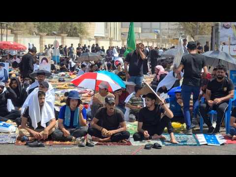 Iraqi pro-Sadr demonstrators gather for Friday prayer near parliament