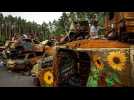 Flowers for Hope: artists paint sunflowers on destroyed vehicles in war-torn Irpin