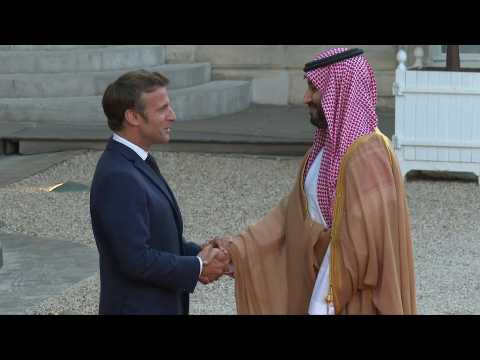 Macron greets visiting Saudi crown prince with handshake