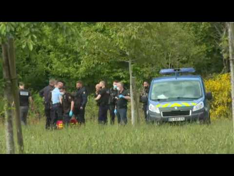 Investigators search area after knife attack on French police