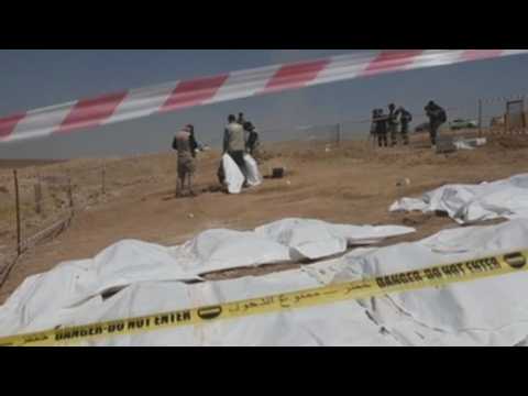 Iraqi forensics inspect mass grave site near Mosul