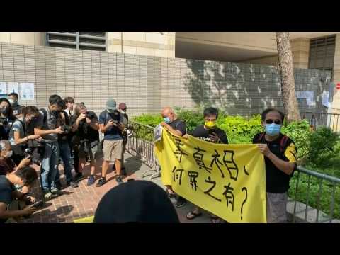 Supporters of Hong Kong's Apple Daily gather outside court