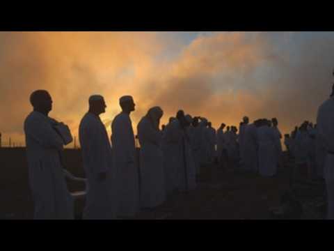Samaritans greet the dawn atop their holiest mountain to mark Shavuot holiday