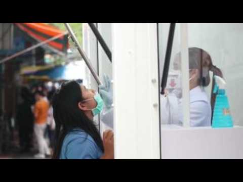 Bangkok authorities carry out swab tests to contain the outbreak