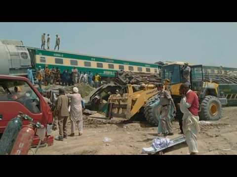 Mangled metal, bulldozers at site of deadly Pakistan train crash