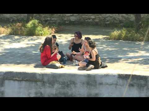 After a rain-marred spring, Parisians finally soaking up the sun