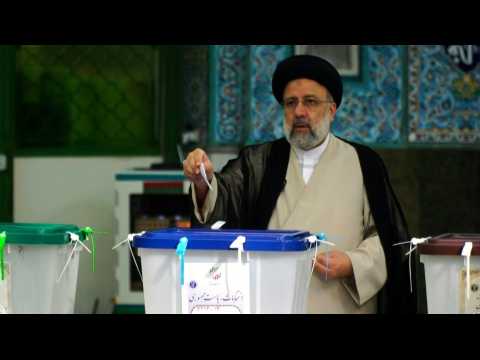 Ultraconservative cleric Ebrahim Raisi casts his ballot
