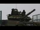 Russian tanks take part in military drills near border with Ukraine