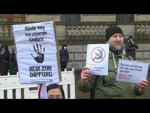 Hundreds gather in Berlin to protest against mandatory vaccination law