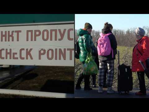 Civilians leave so-called Donetsk People's Republic, queue at checkpoint at Russian border