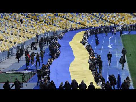 Ukrainians deploy giant national flag to mark 'Unity Day'