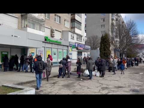 Queues form outside banks, pharmacies and petrol stations in Lviv