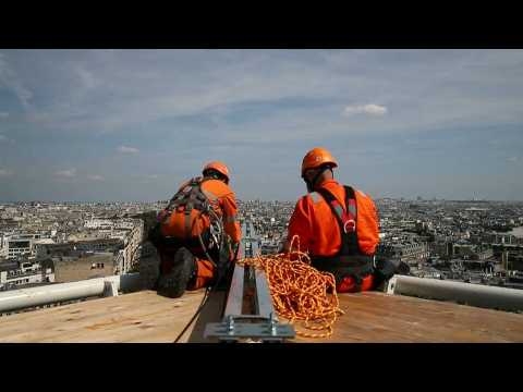 Installation of Christo's work on the Arc de Triomphe in Paris continues