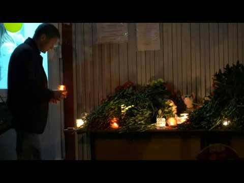 Russians mourn campus shooting spree victims with candles, flowers