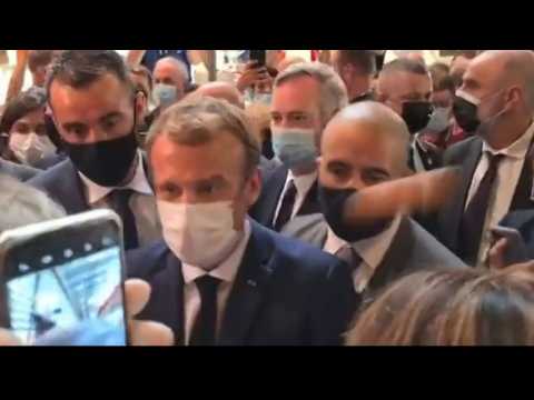 French President Emmanuel Macron hit with egg during restaurant fair visit