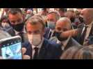 French President Emmanuel Macron hit with egg during restaurant fair visit