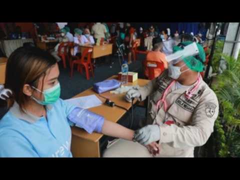 Covid-19 vaccination drive for market vendors in Medan