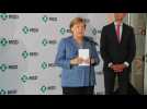 Merkel attends MSD's Ebola vaccine production facility