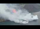 Canaries volcano lava reaches sea, raising toxic gas fears