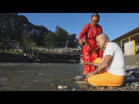 Hindu devotees in Nepal gather at bank of rivers to pay homage to ancestors