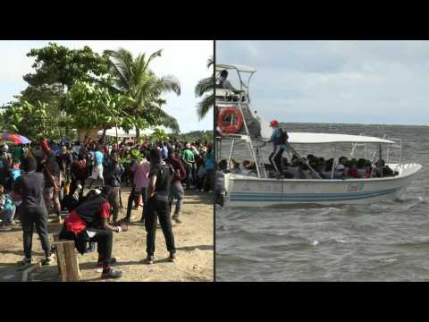 Migrants cross the Gulf of Uraba in Colombia on their way to Panama