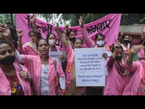 Indian workers rally to demand better working conditions, higher wages in New Delhi