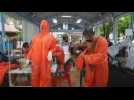Thai temple makes covid-19 protective suits with recycled plastics