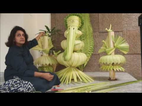 Floral artist creates figure of Hindu god Ganesh with banana leaves