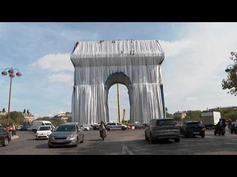 Parisians, tourists admire wrapping of Arc de Triomphe, tribute to Christo