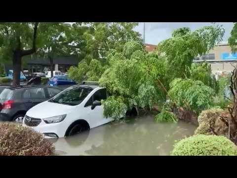 Flooded streets and uprooted trees after violent storms in south of France