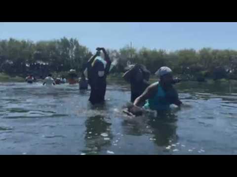 Haitian migrants cross Rio Grande river between US and Mexico