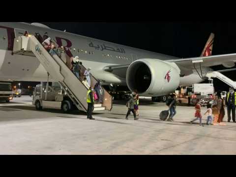 Passengers from Kabul flight disembark in Doha
