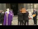 Belmondo casket carried into church ahead of service