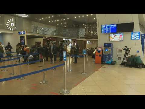 Migrants wait at Minsk airport before first Iraqi repatriation flight