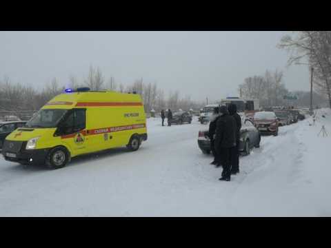 Emergency vehicles arrive, as eleven dead, dozens missing in Siberia coal mine accident