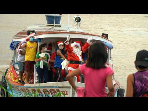 Santa Claus swaps reindeer for a boat to visit kids in remote Brazil