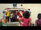 Santa Claus swaps reindeer for a boat to visit kids in remote Brazil