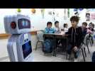 An educational robot interacts with students at a Gaza school.