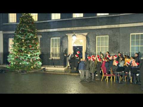 UK PM Johnson turns on Christmas lights outside 10 Downing Street
