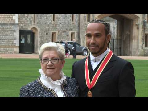 F1 driver Lewis Hamilton receives knighthood at Windsor Castle