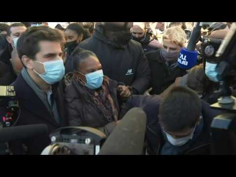Former French justice minister mobbed by supporters during visit to Saint Denis near Paris