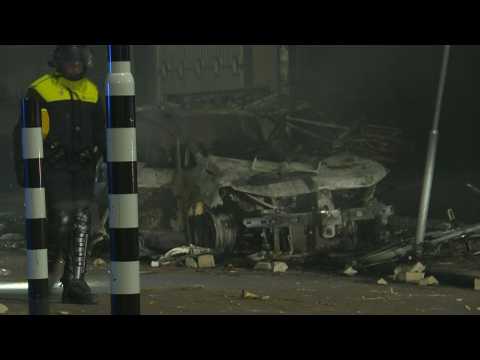 Dutch police inspect damage in aftermath of Covid riot